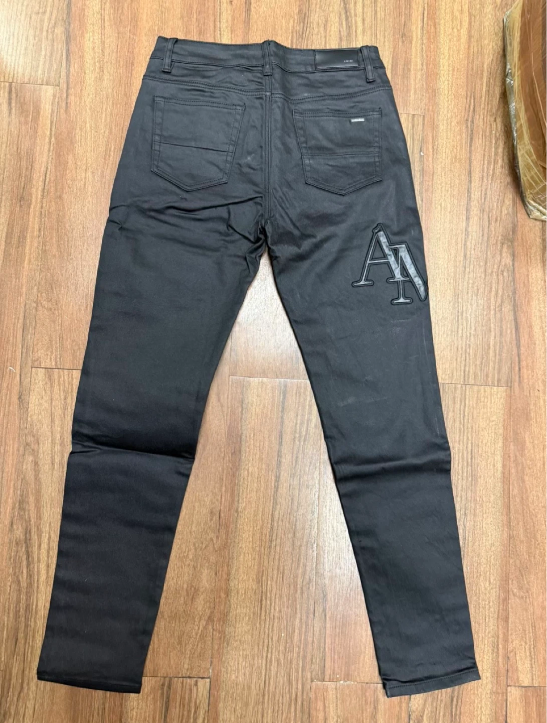 Amiri Staggered Logo Waxed Skinny Jeans - Black - photo 3