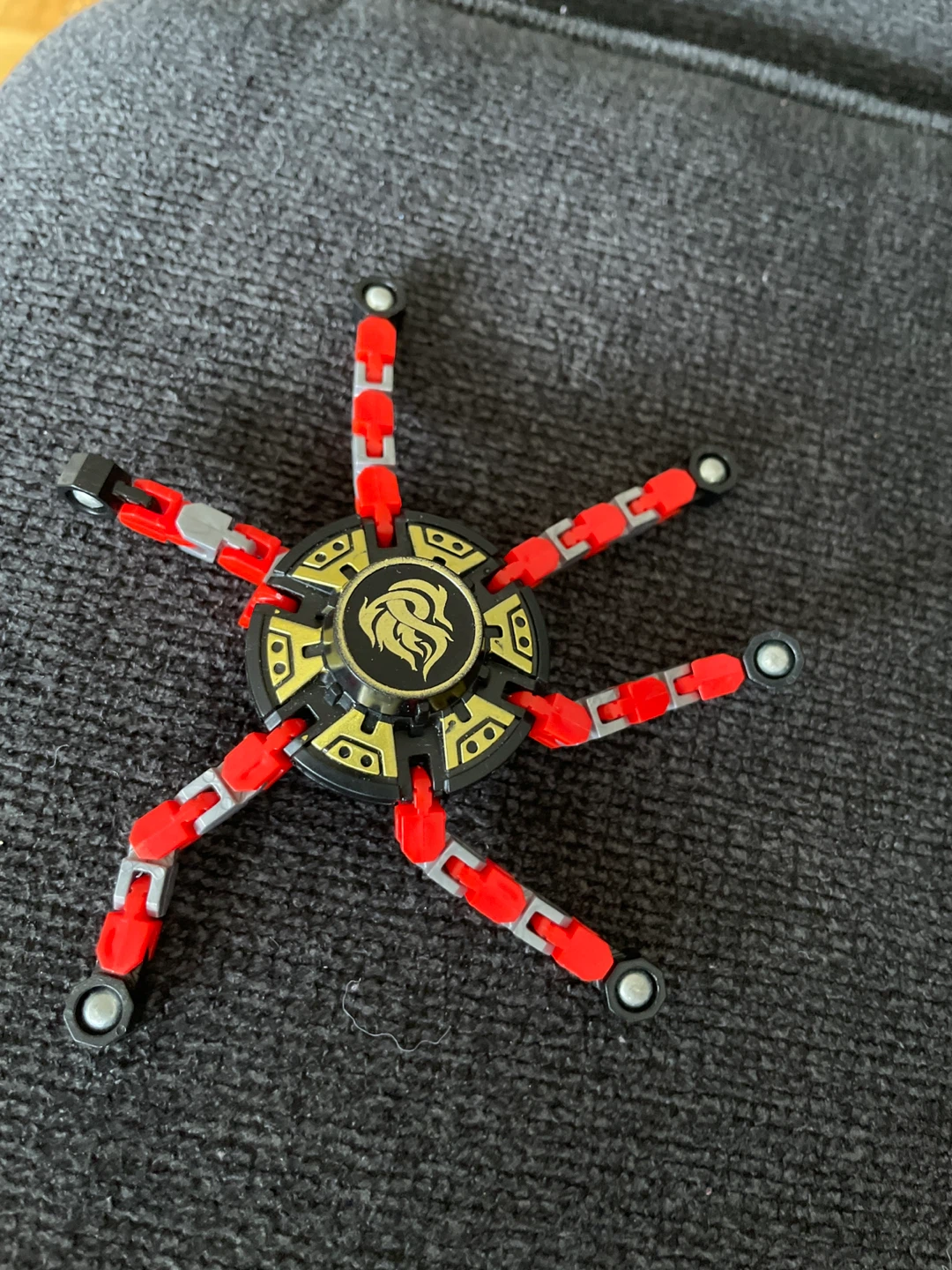 Fidget Spinner Toy with Red and Gold Accents