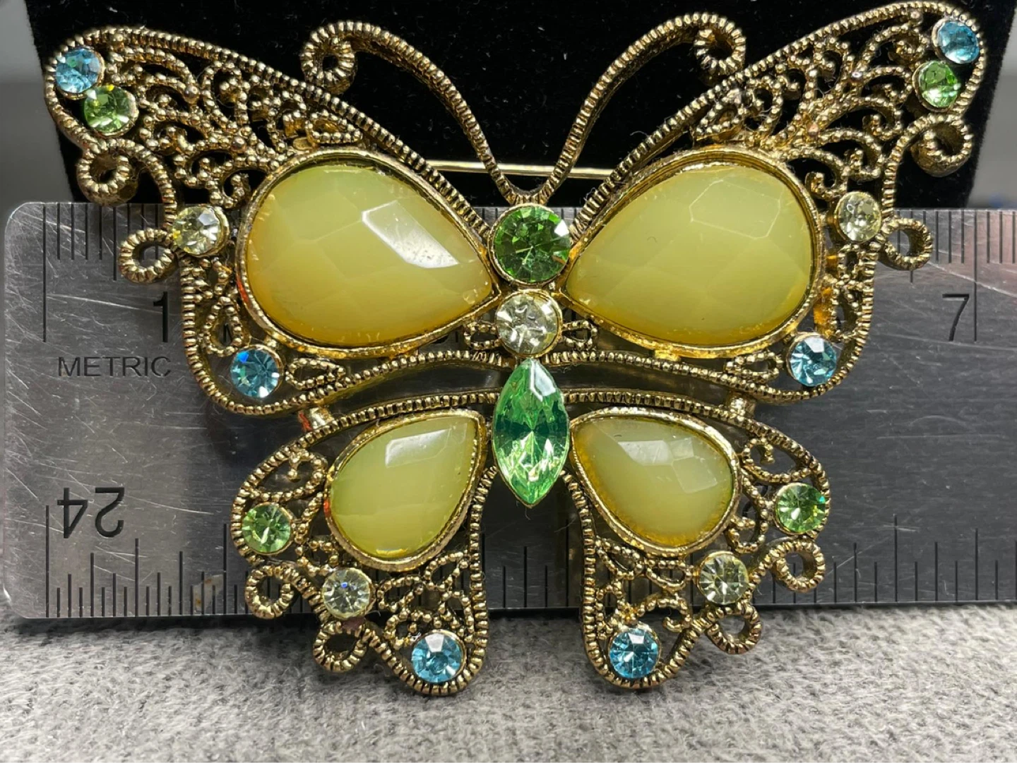 Gold Tone Butterfly Brooch with Green and Blue Gems
