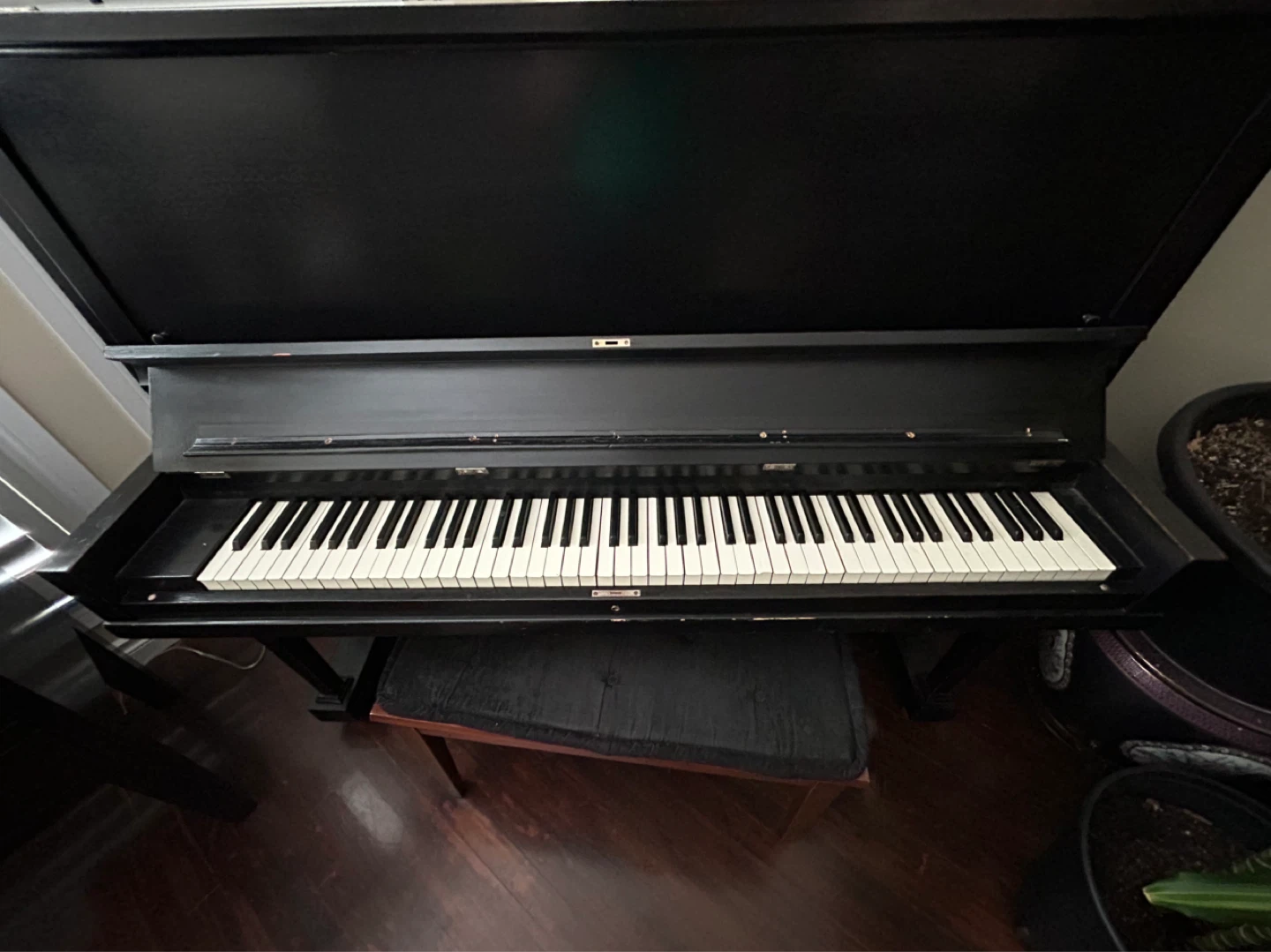 Black Upright Piano with Bench