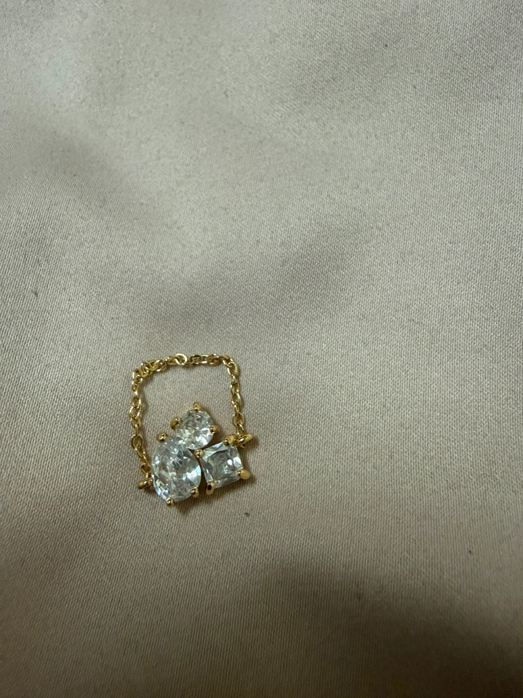 Gold-tone ring with cubic zirconia stones