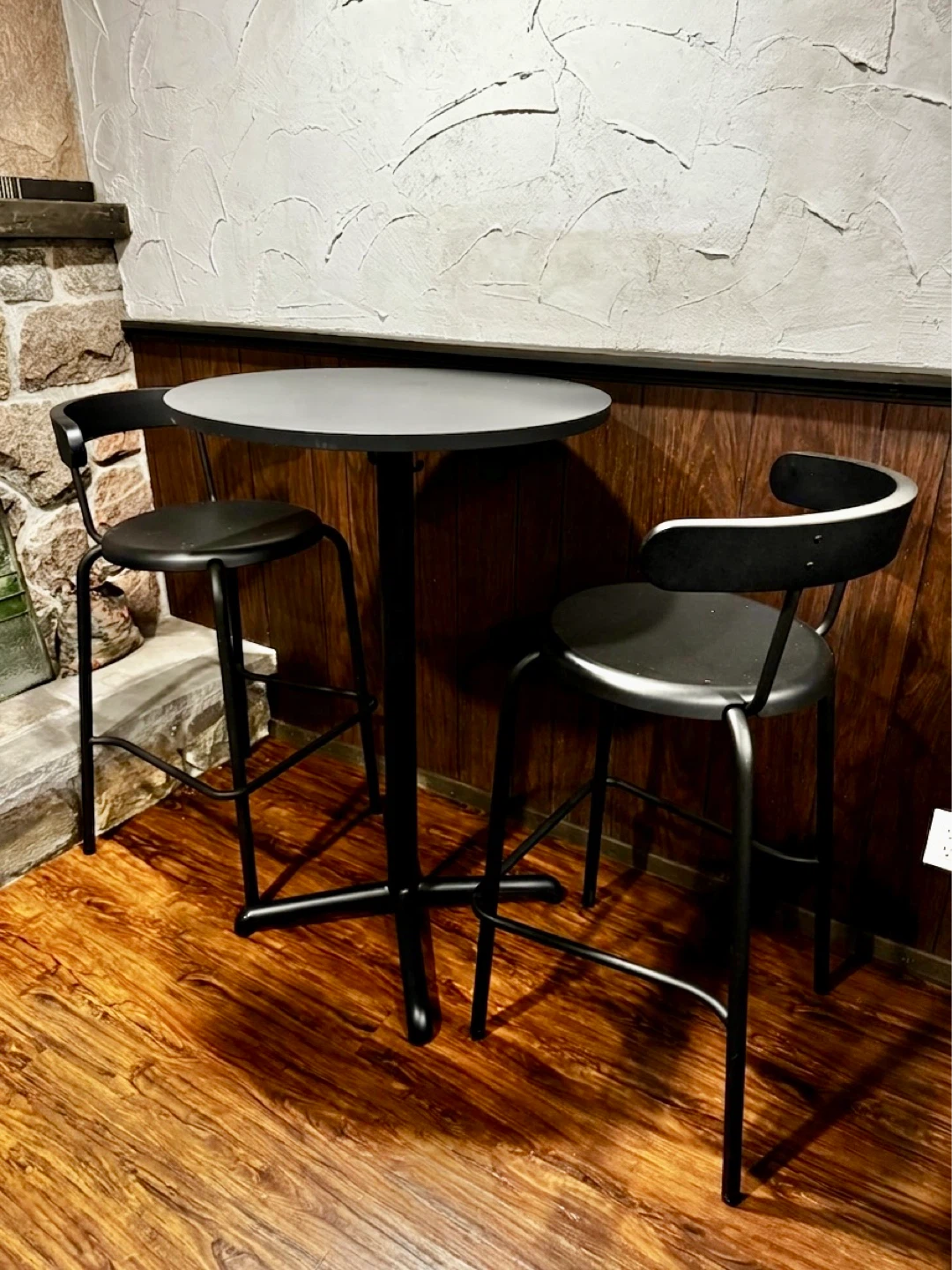 Round Bistro Table with 2 Black Bar Stools