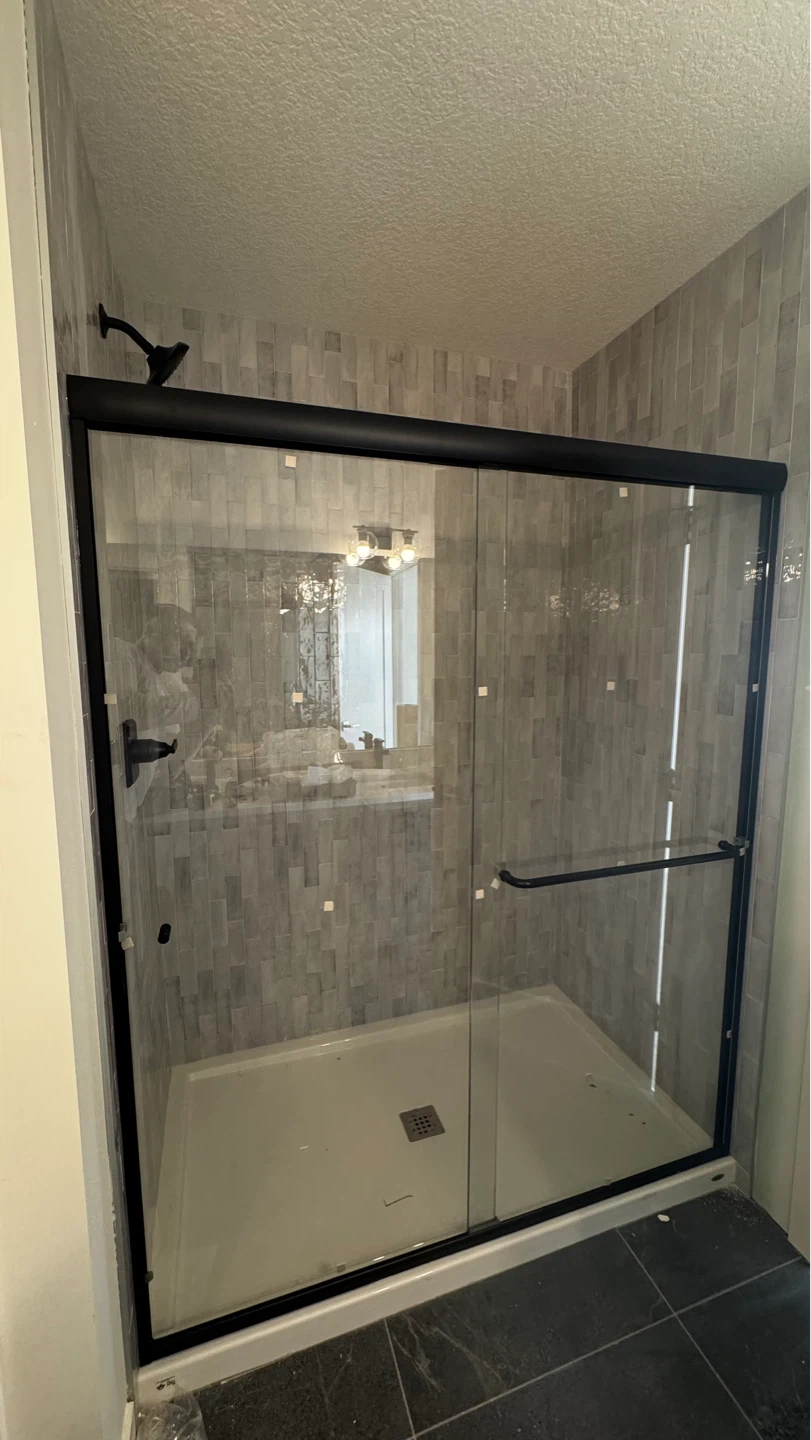 Framed Bathroom Mirror and Shower Enclosure