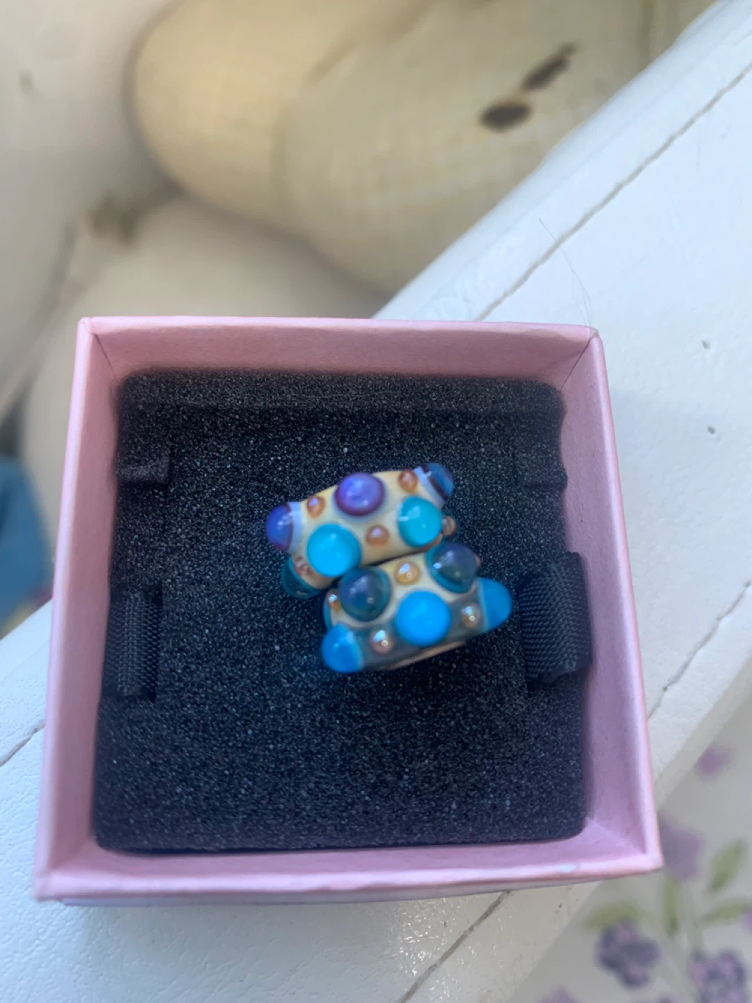 Two glass beads with colourful accents