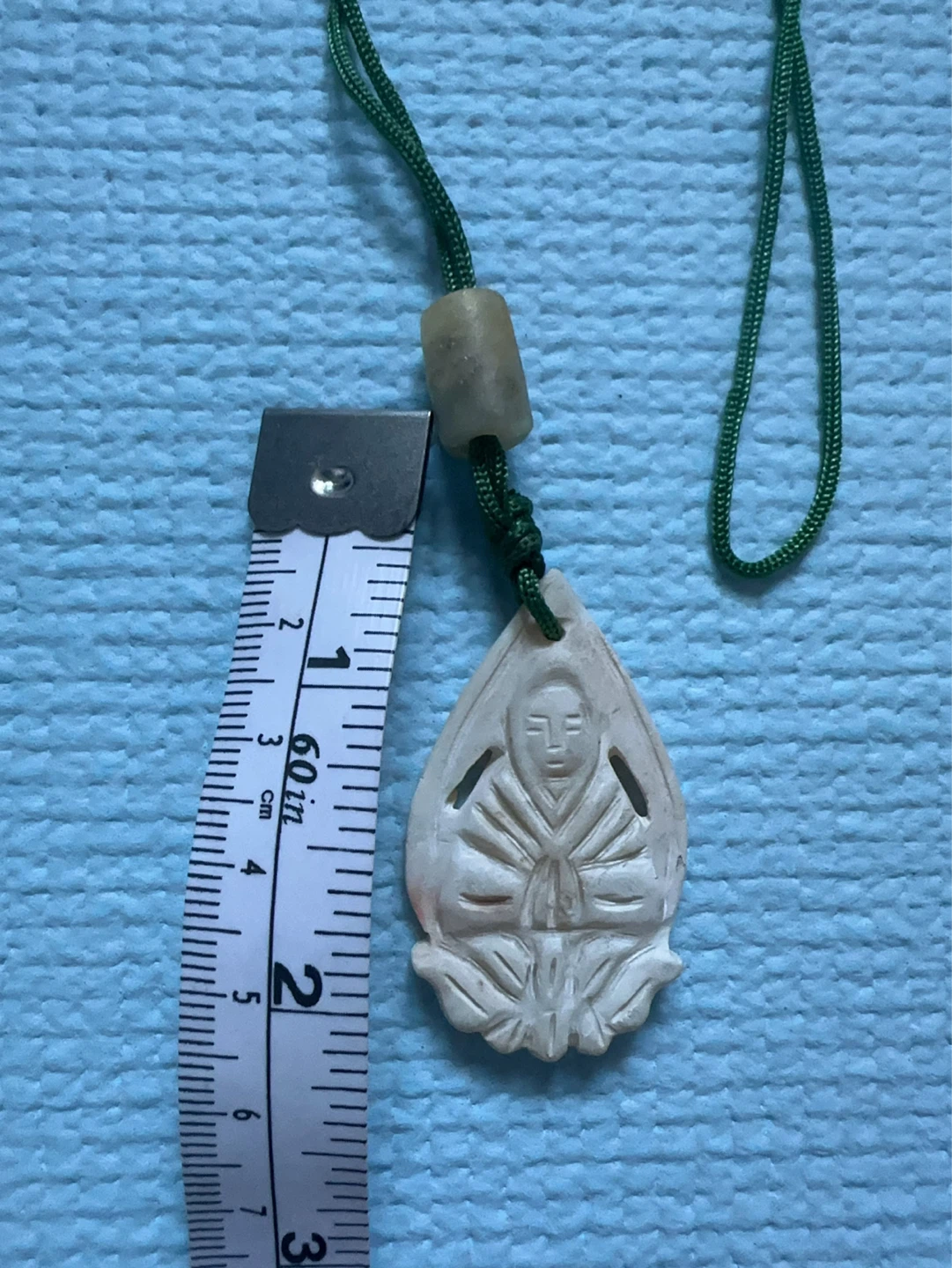 Handcrafted Cream Buddhist Pendant Necklace with Green Cord