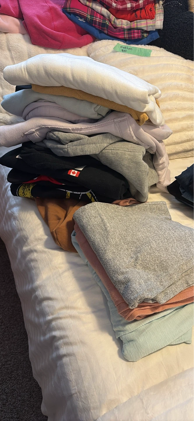 Stack of assorted sweatshirts