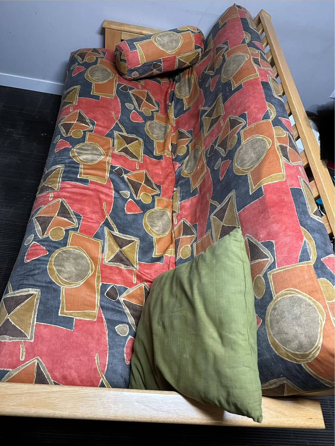 Wooden Futon with Patterned Mattress and Pillows