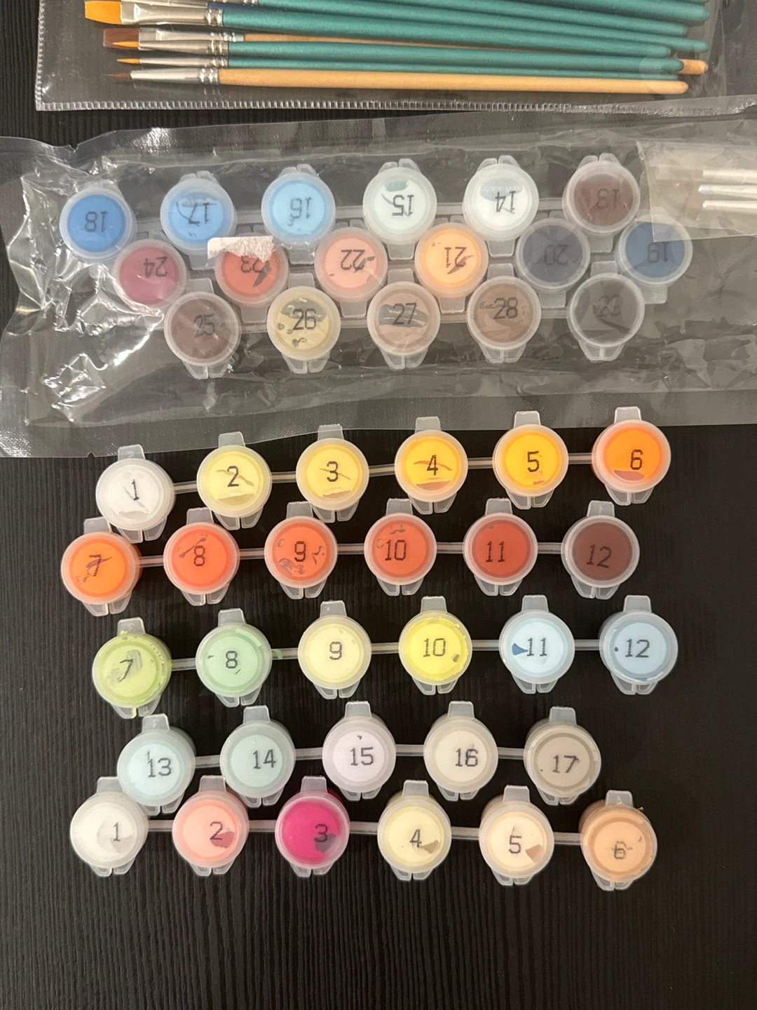 new paint brushes and unopened paints - photo 2