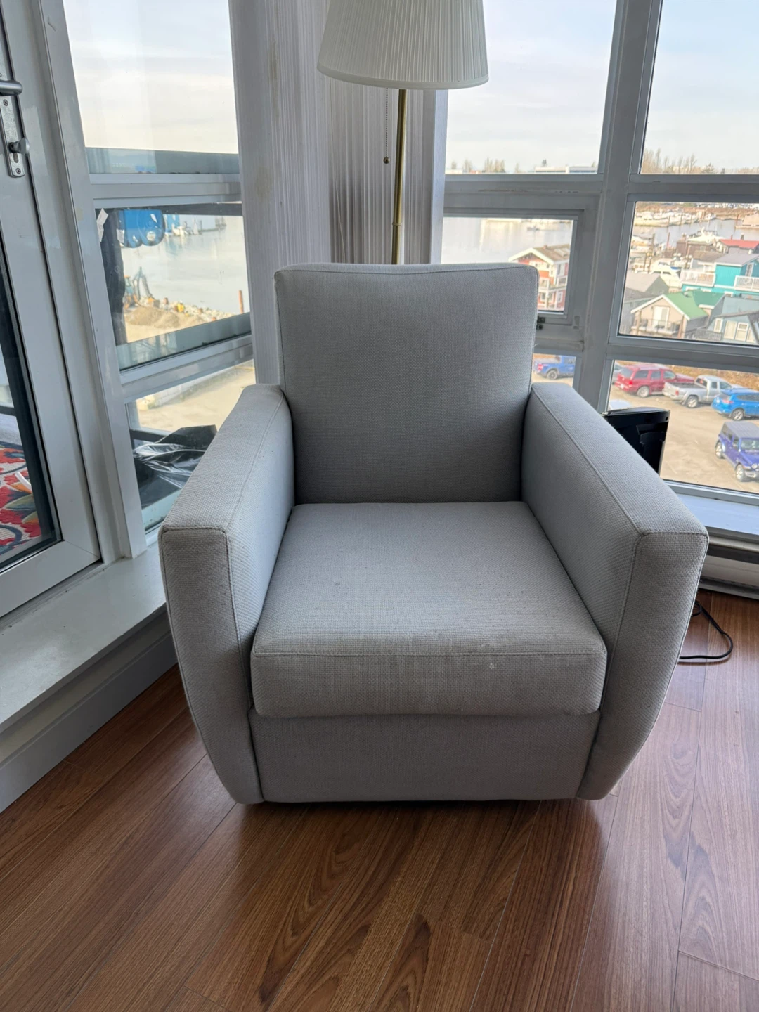 Grey fabric revolving armchair