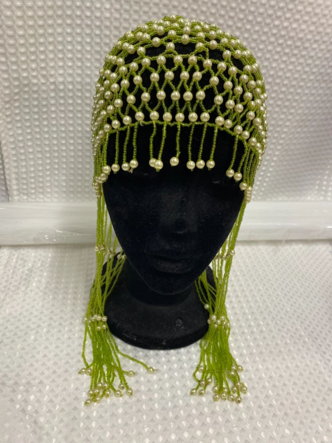 Green beaded cap with pearl fringe
