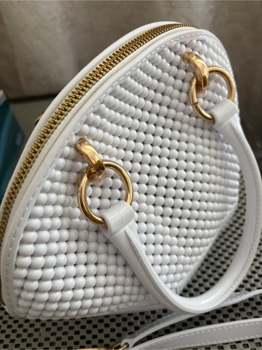 White beaded handbag with gold hardware