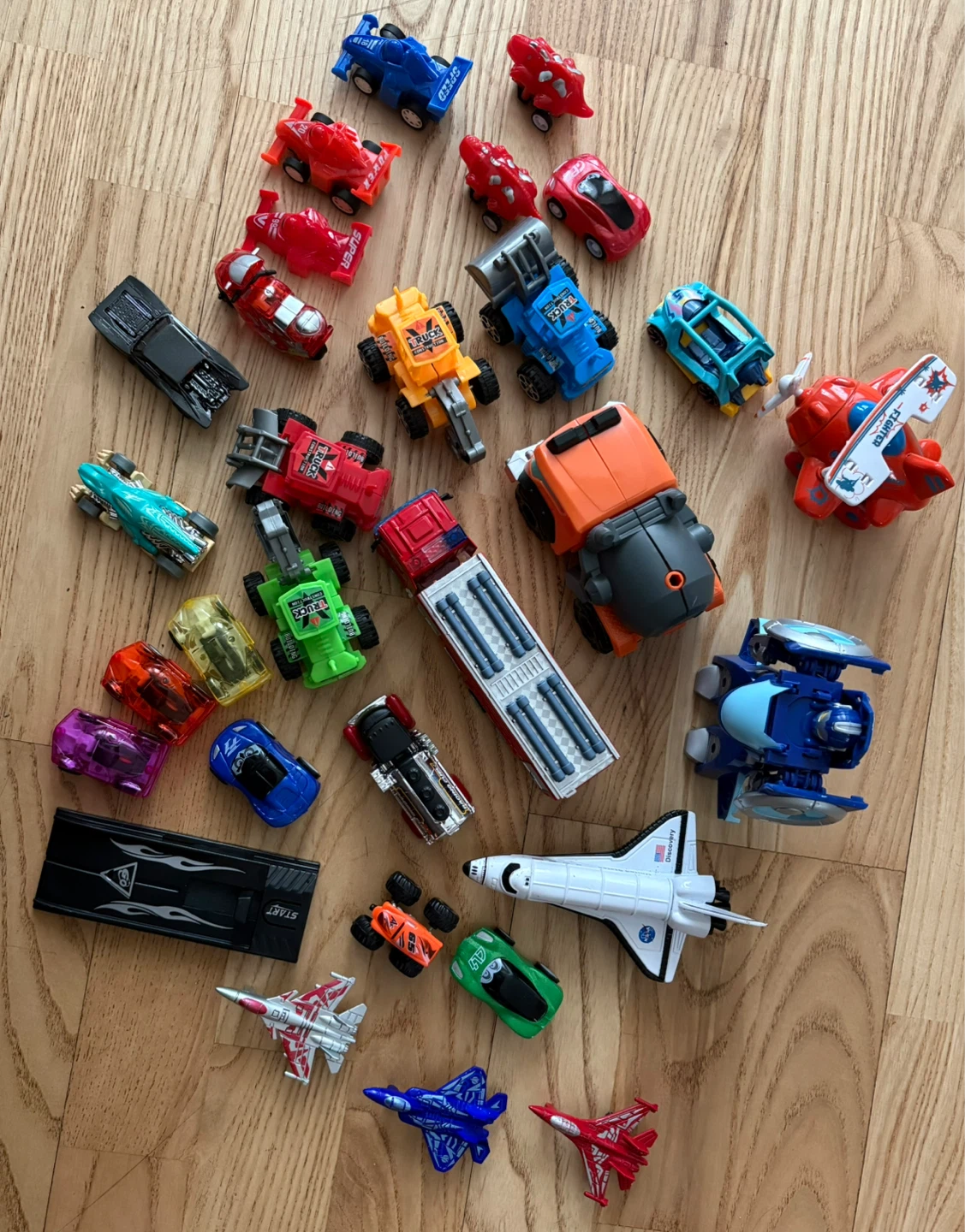 Assorted Toy Cars, Trucks, and Airplanes
