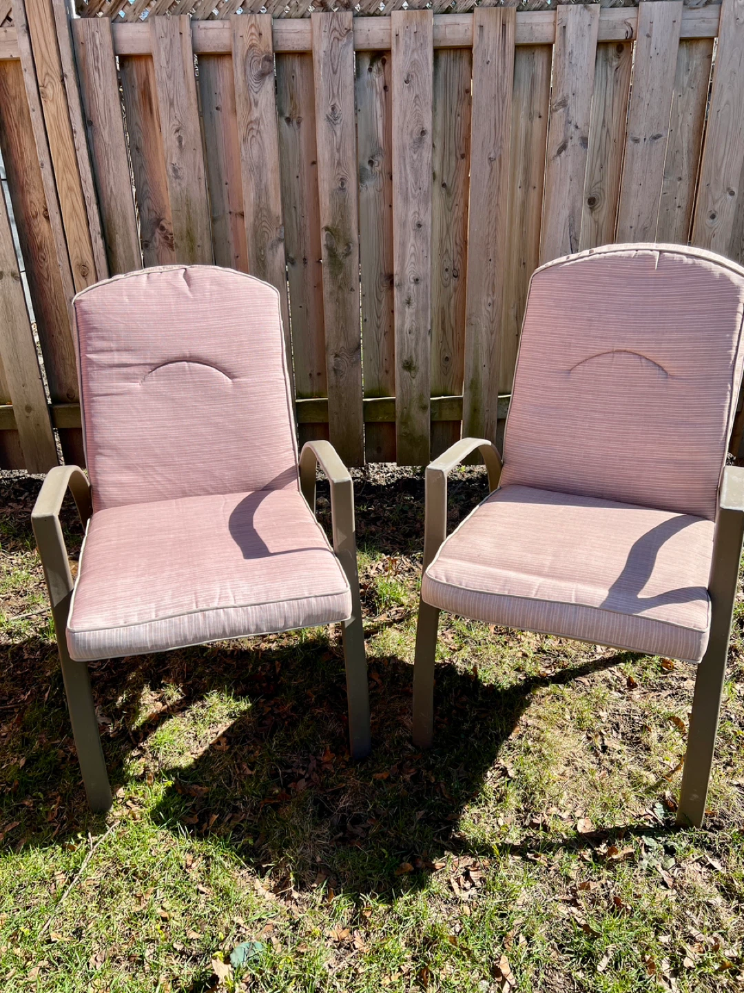 Pair of light tan striped patio high back chairs