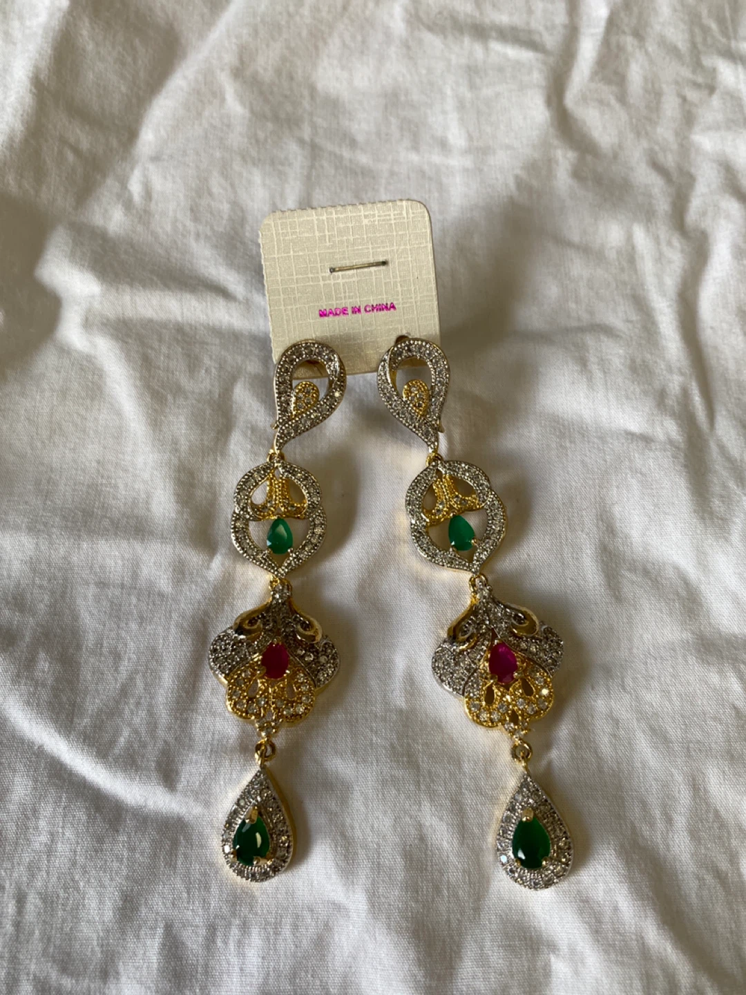 Gold-tone long drop earrings with green and red stones