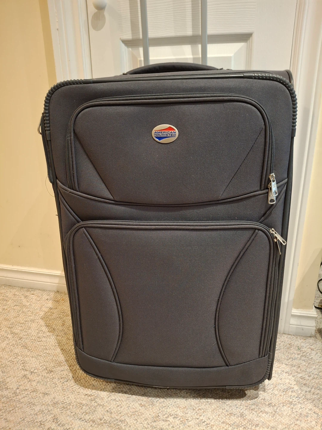 American Tourister grey suitcase