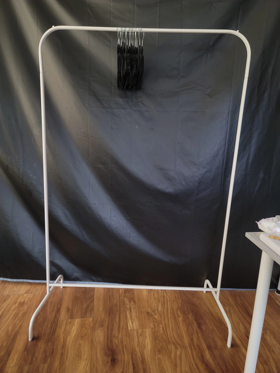 White Metal Garment Rack with Black Hangers