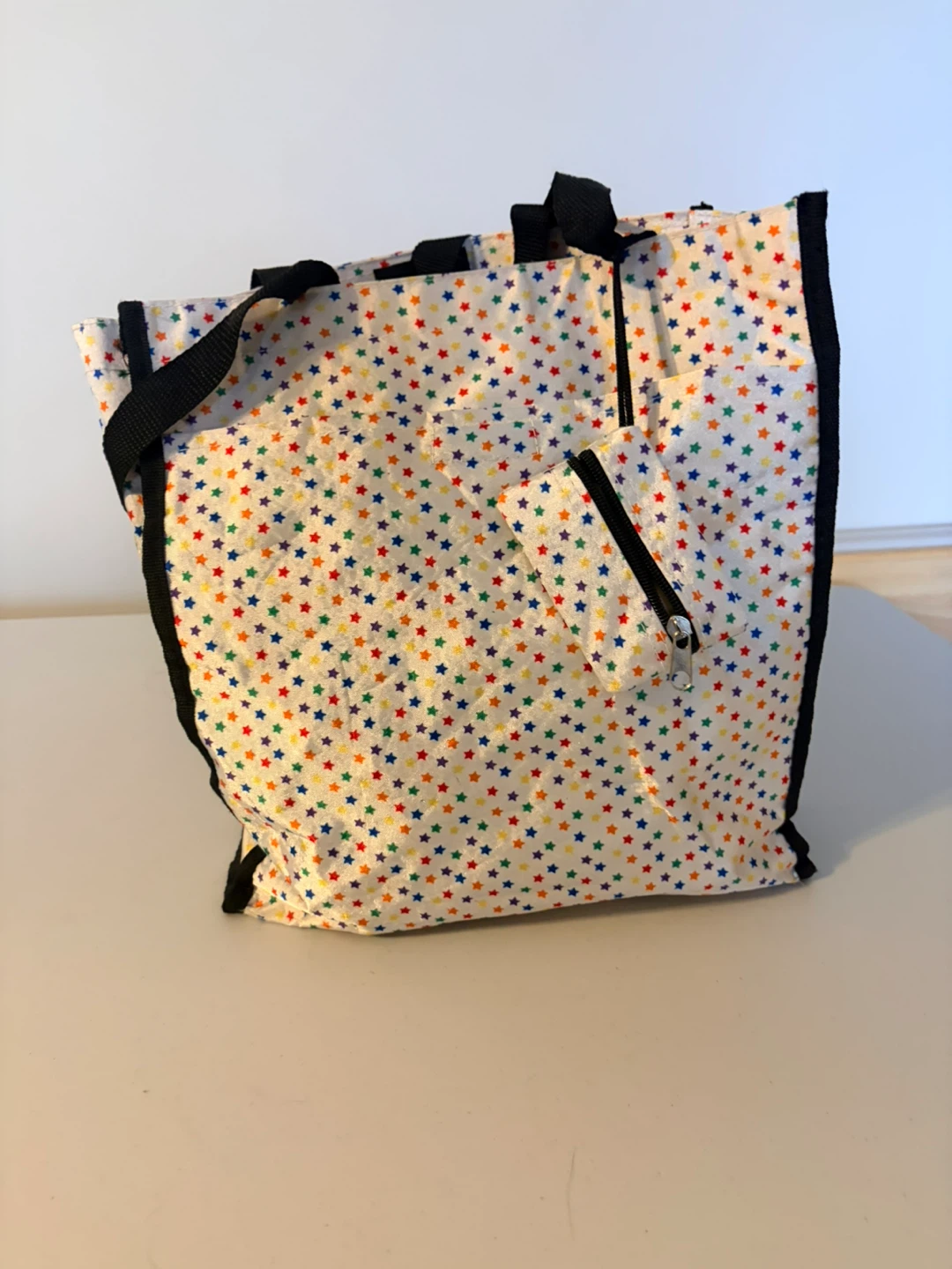 White tote bag with colourful stars and matching pouch