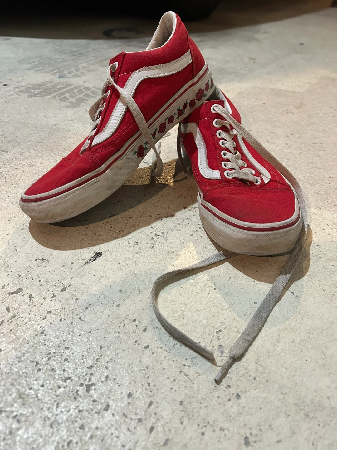 Vans low top red shoes with custom rose detailing