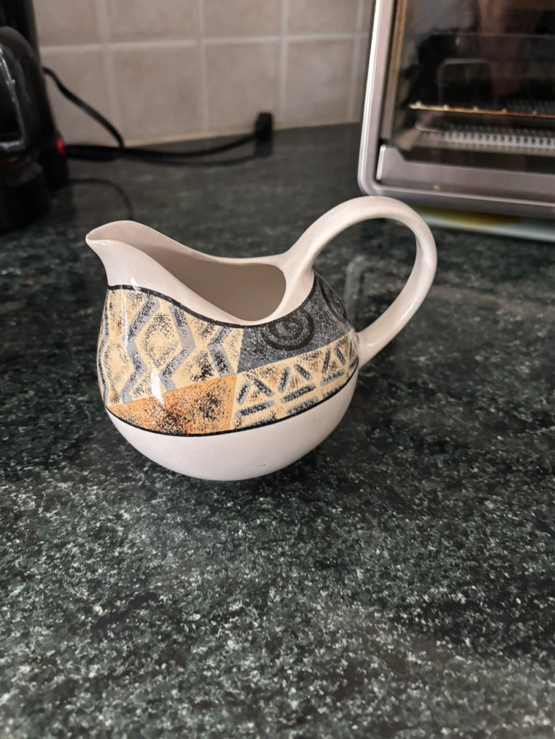 Sango Ivory Coast Creamer by Sue Zipkin
