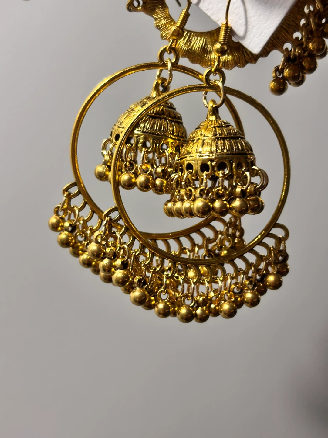 Gold coloured jhumka earrings with decorative details - photo 2