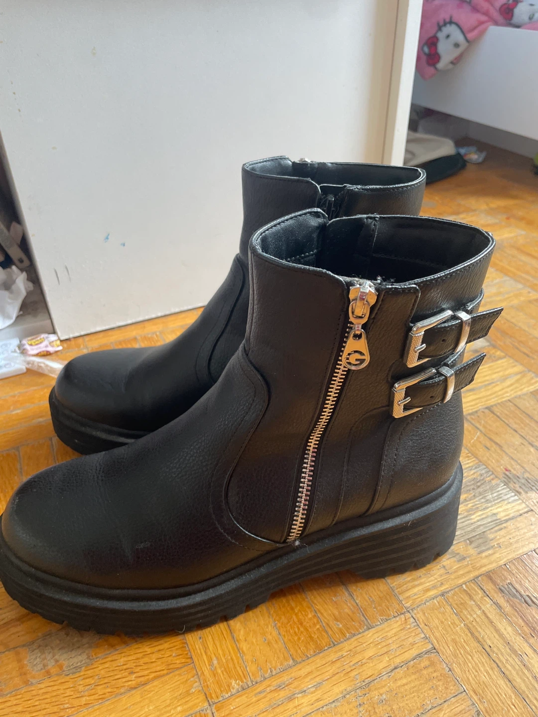 Boots with a little clip on the side with a zipper