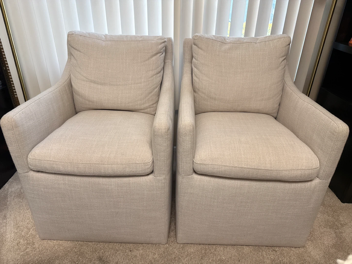 Pair of Beige Upholstered Swivel Accent Chairs