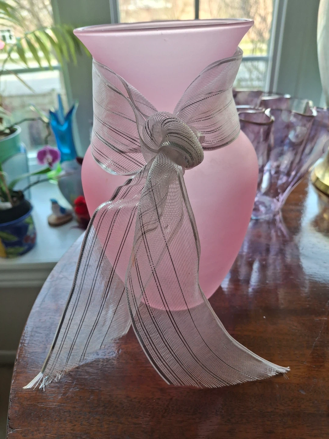 Pink frosted glass vase with ribbon accent