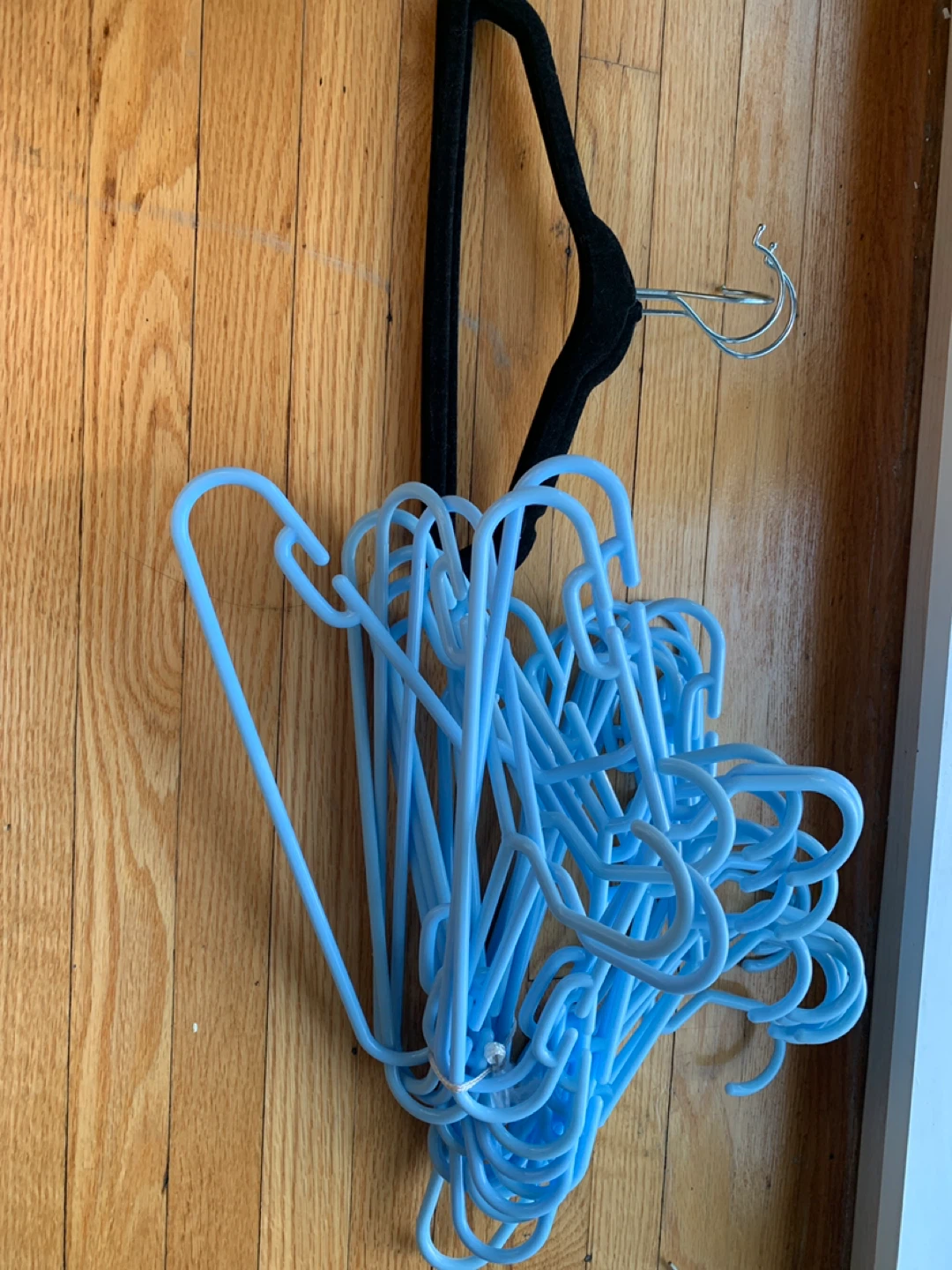 Bundle of blue plastic hangers