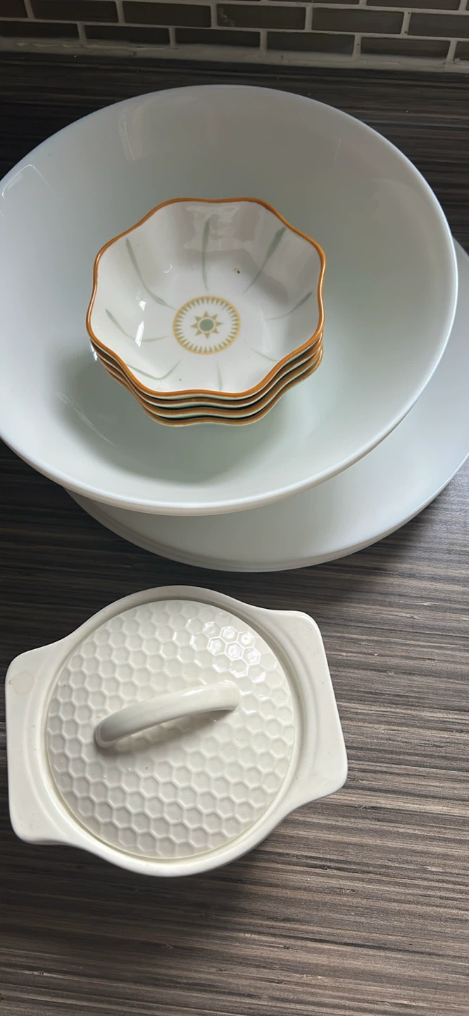 White serving bowls and small decorative dishes