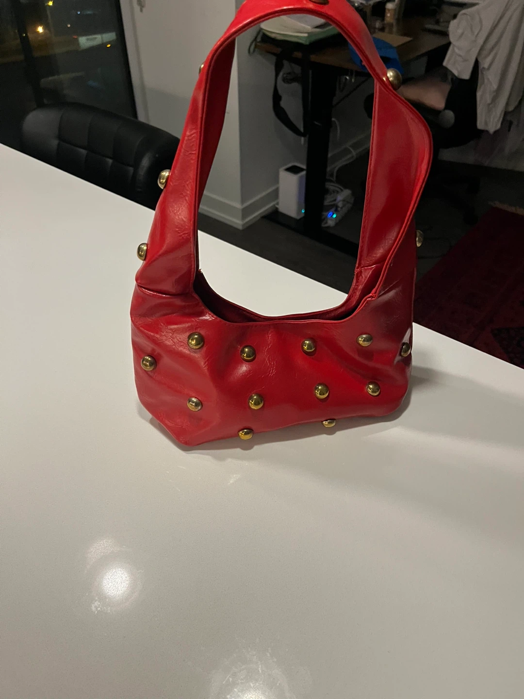 Red studded shoulder bag