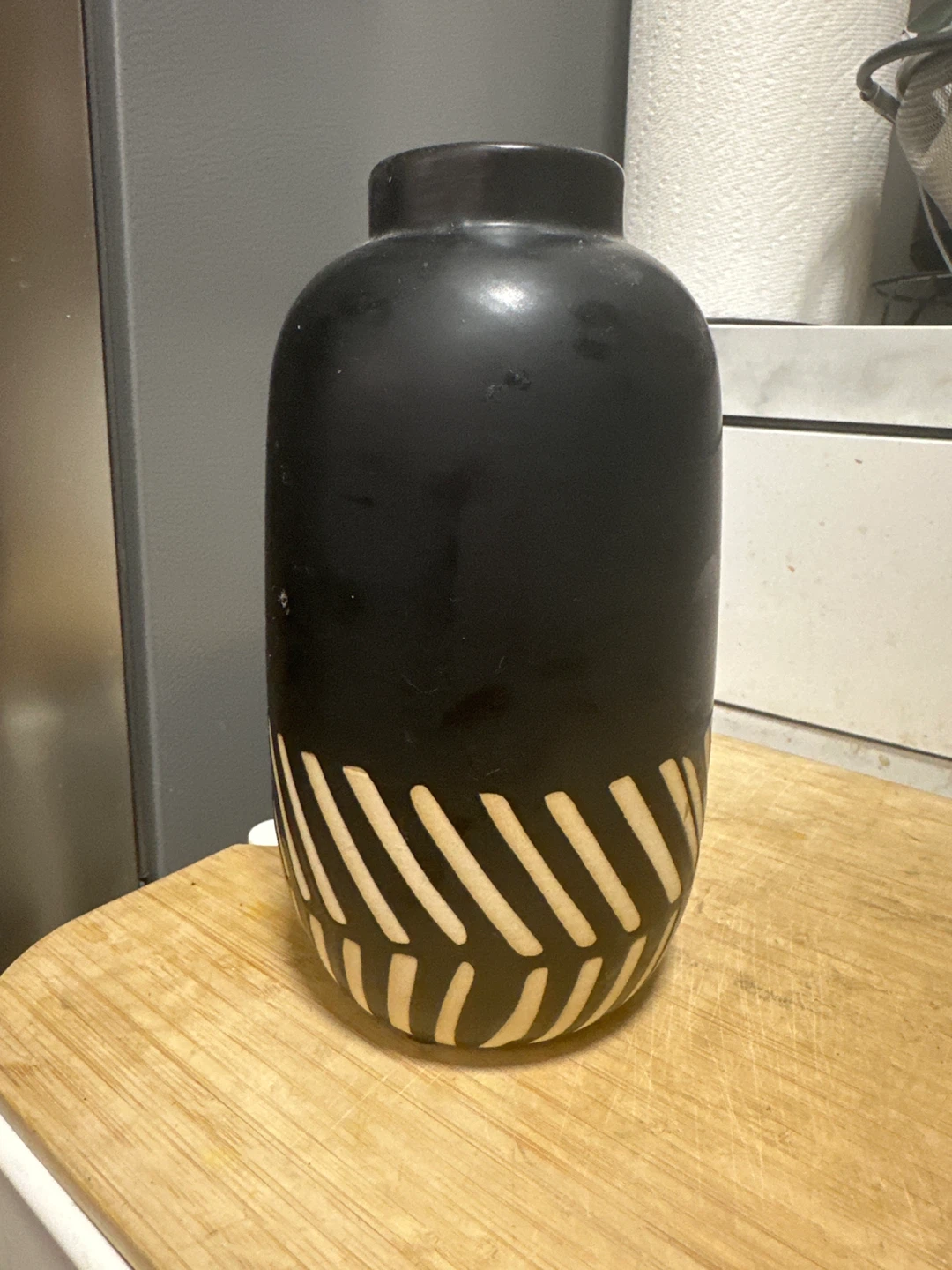 Black and wood tone geometric vase