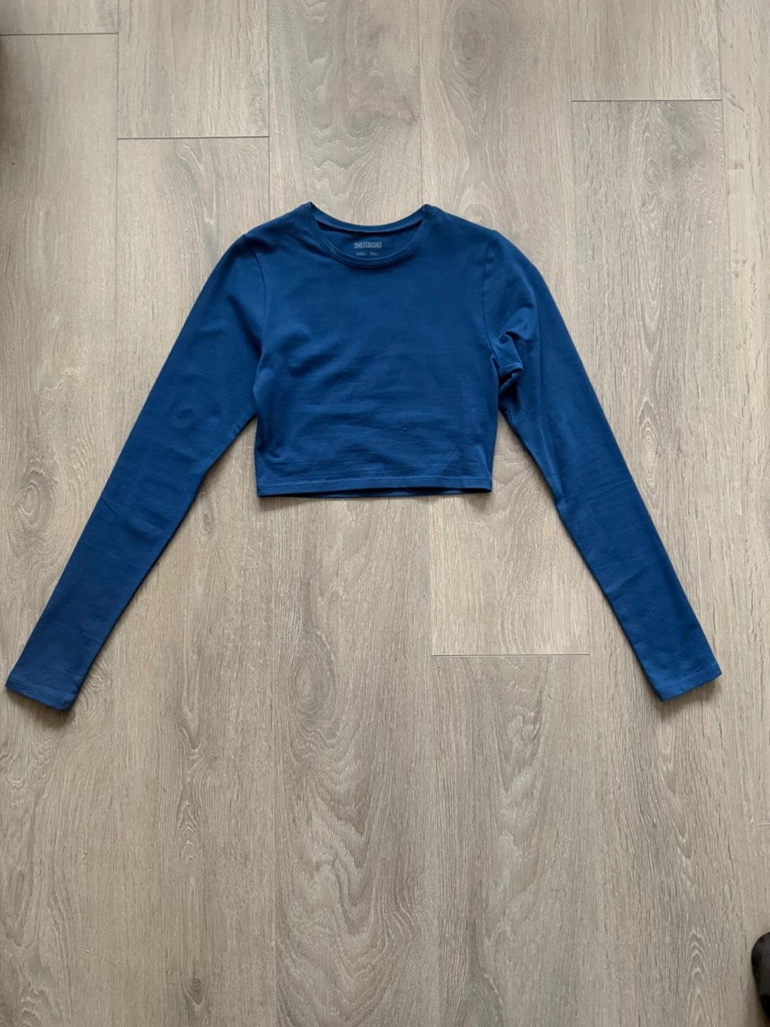 She is Mono Blue Long Sleeve Cropped Top