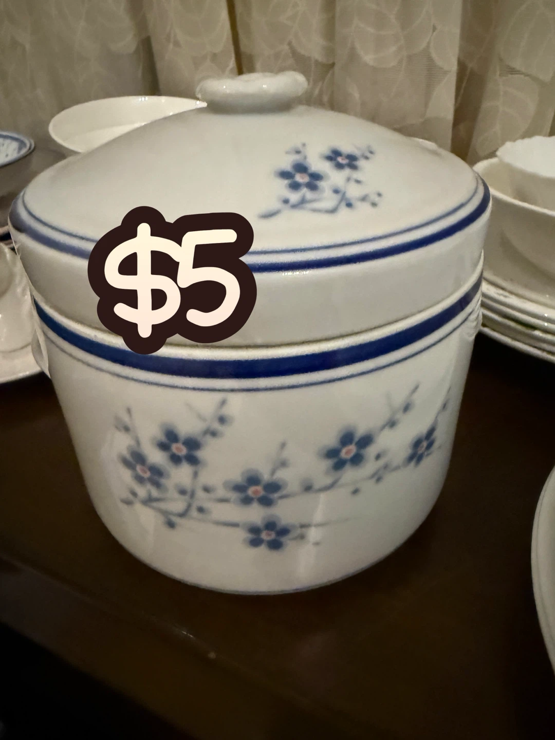 White ceramic pot with blue floral design