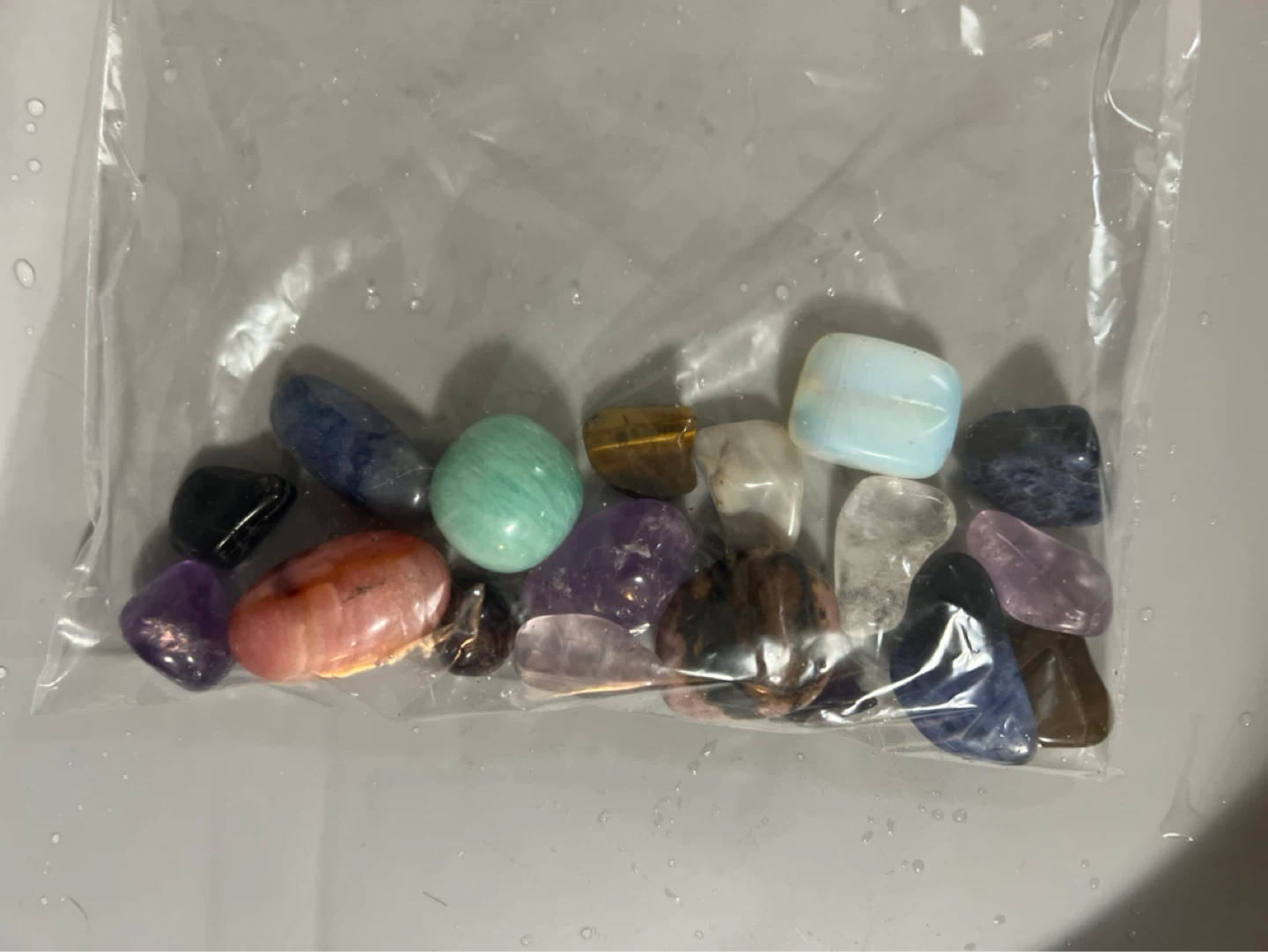 Bag of assorted polished gemstones