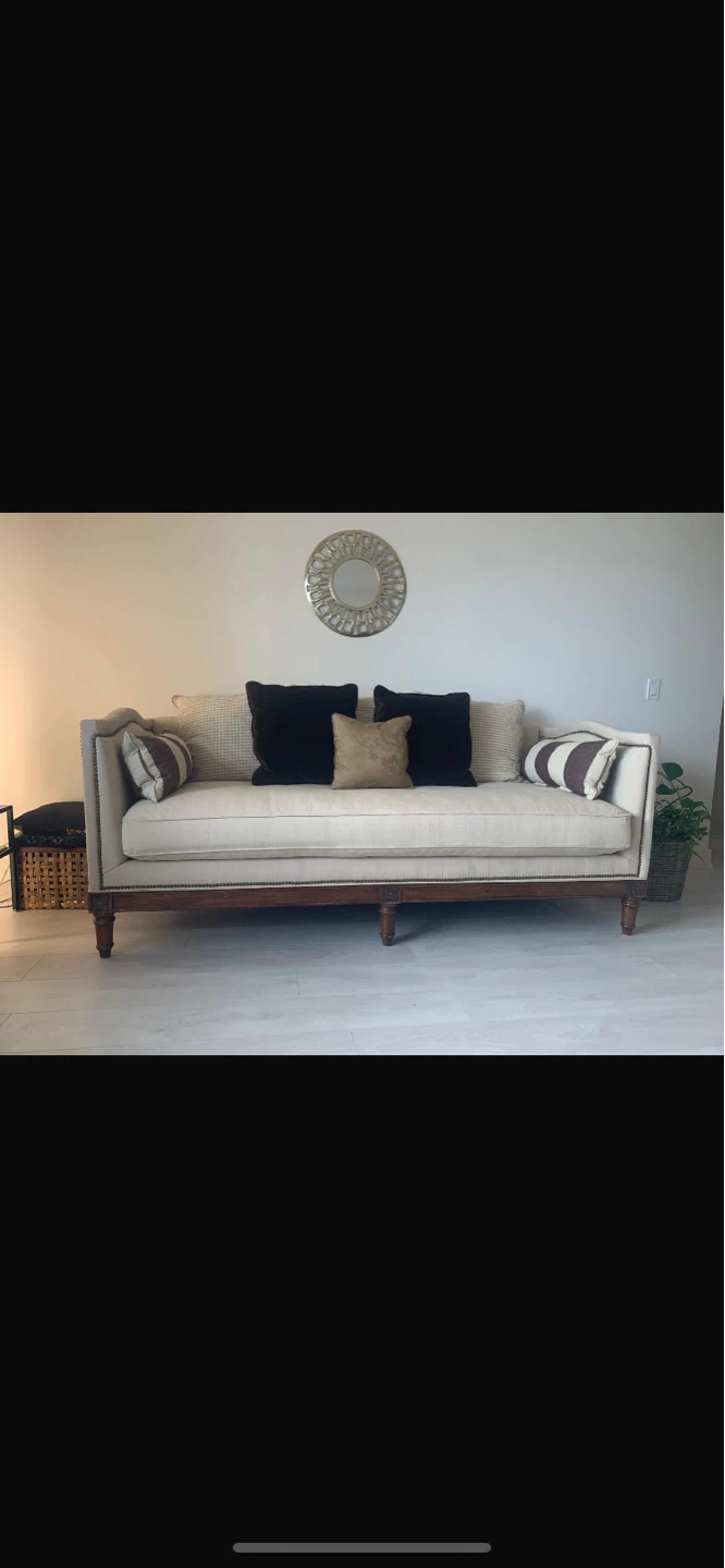 Beige Sofa with Decorative Studding and Pillows