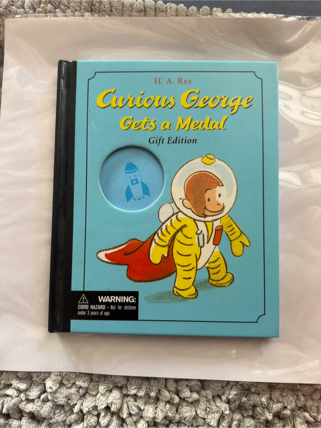 Curious George Gets a Medal Gift Edition Book