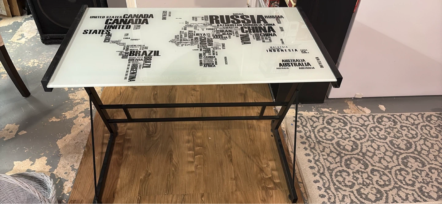 Glass top desk with world map design