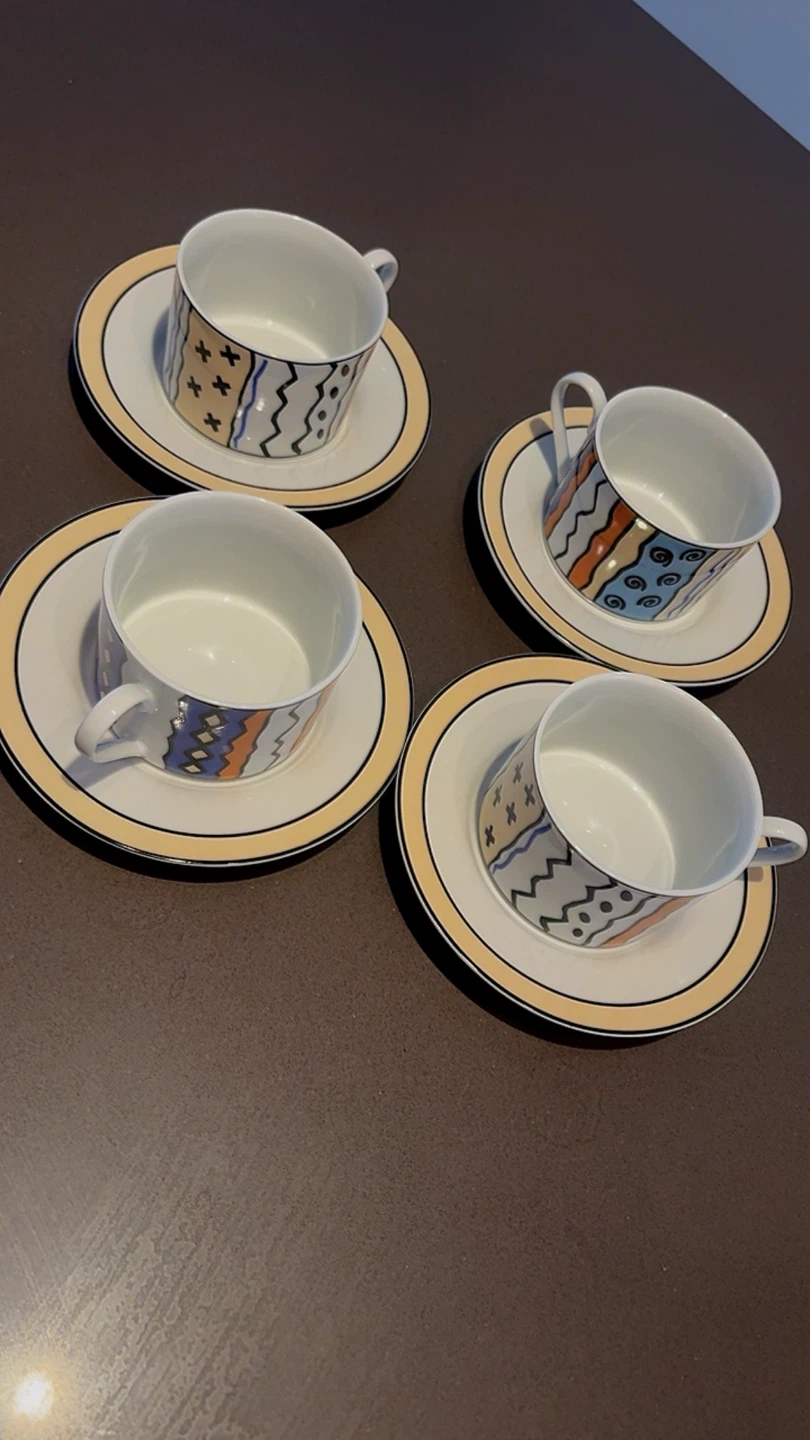 Set of 4 Mugs and Saucers