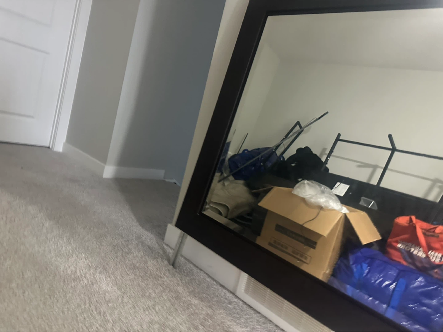 Large black framed mirror