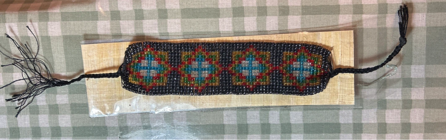 Beaded Bracelet with Geometric Pattern and Tassels