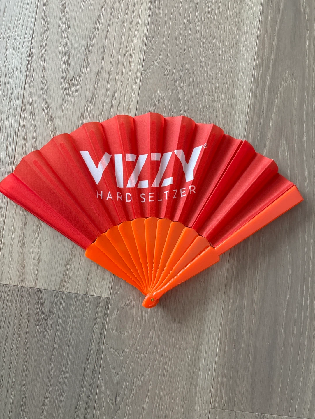 Two Foldable orange fans