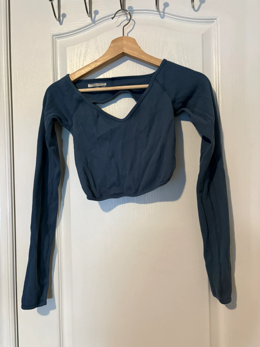 blue ribbed long sleeve crop top with back cutout