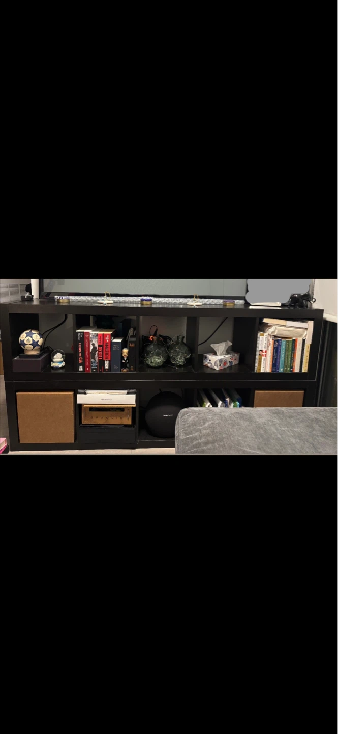 2-Wooden shelf units with multiple compartments.
