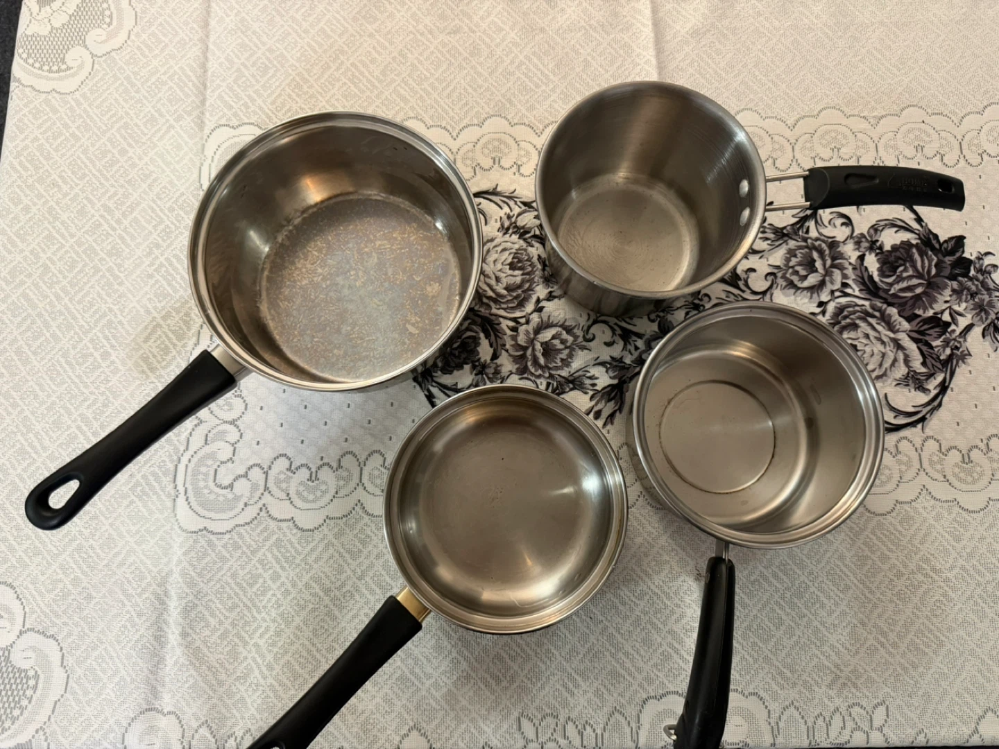 Set of 4 Stainless Steel Saucepans with Black Handles