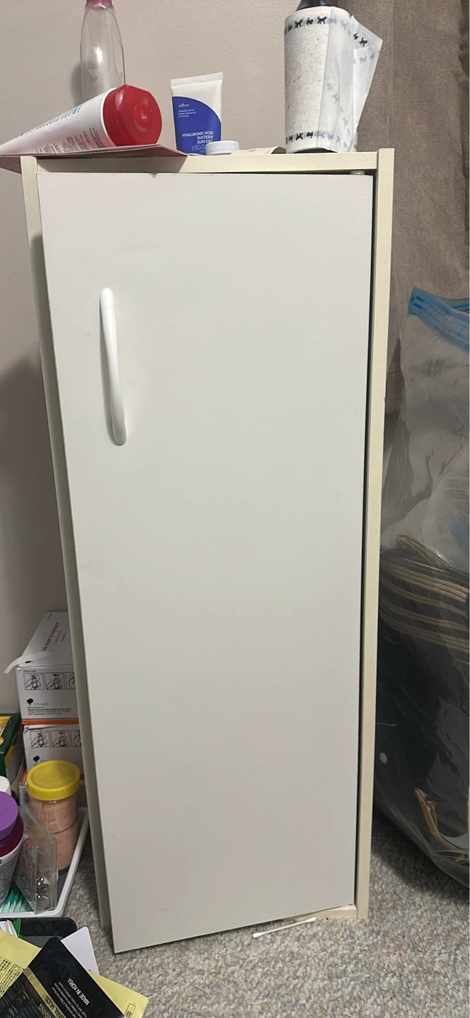 White narrow cabinet with handle