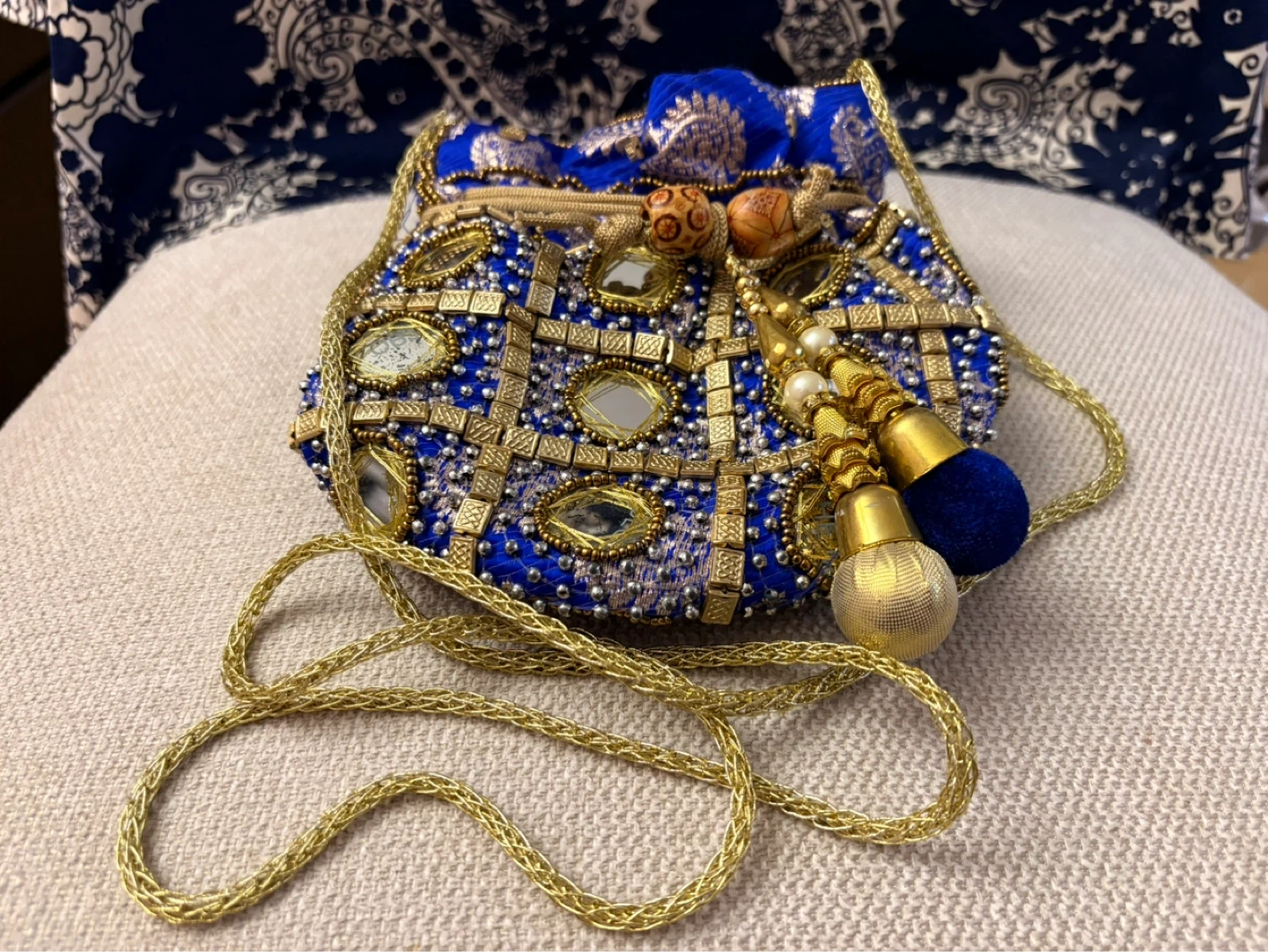 Embellished Blue Drawstring Pouch Bag with Gold Chain