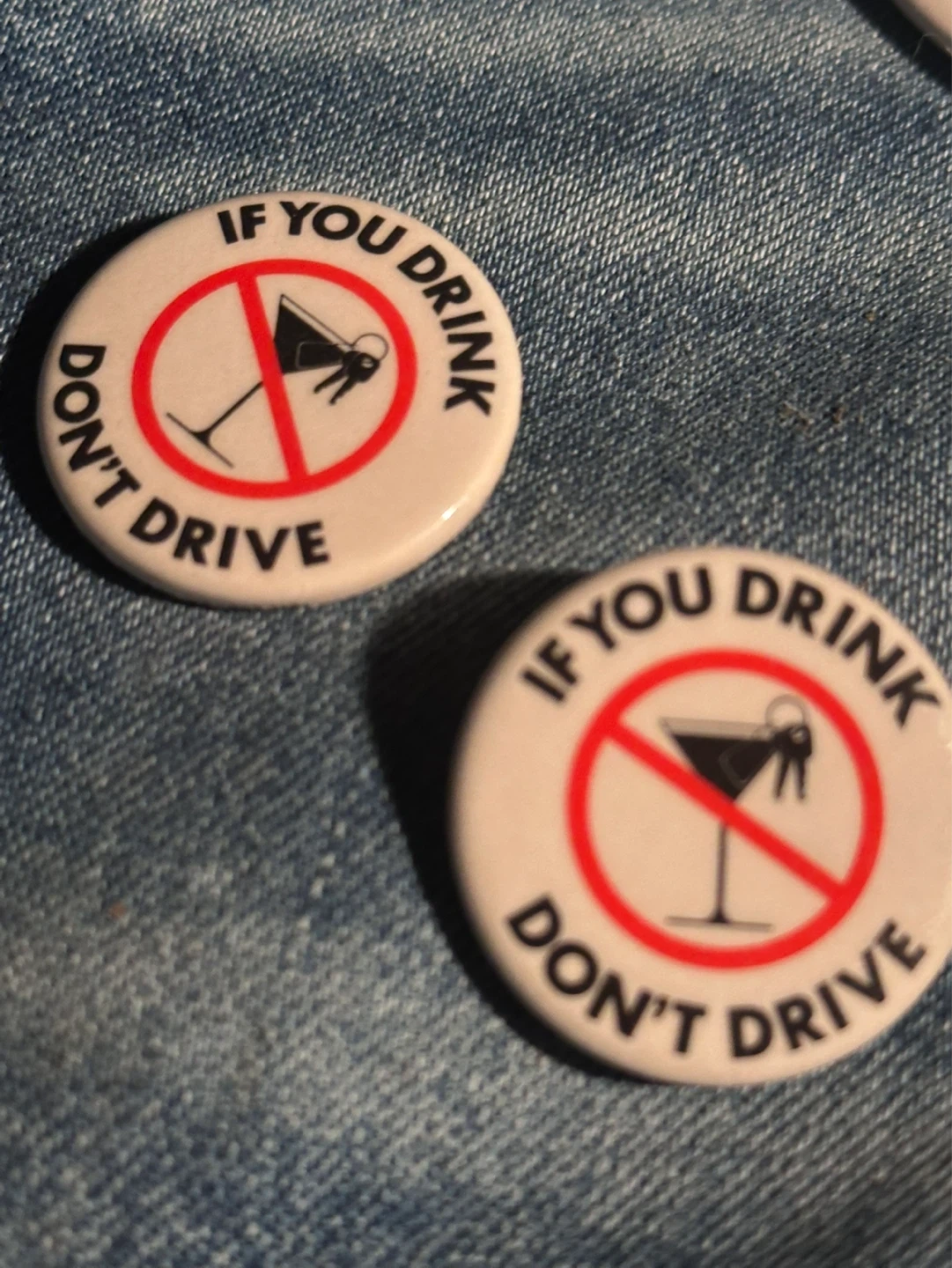 Pair of vintage drink and driving buttons