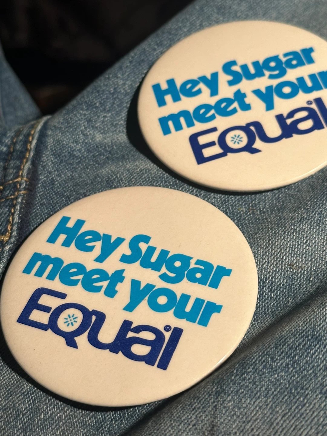 Pair of vintage equal advertising buttons