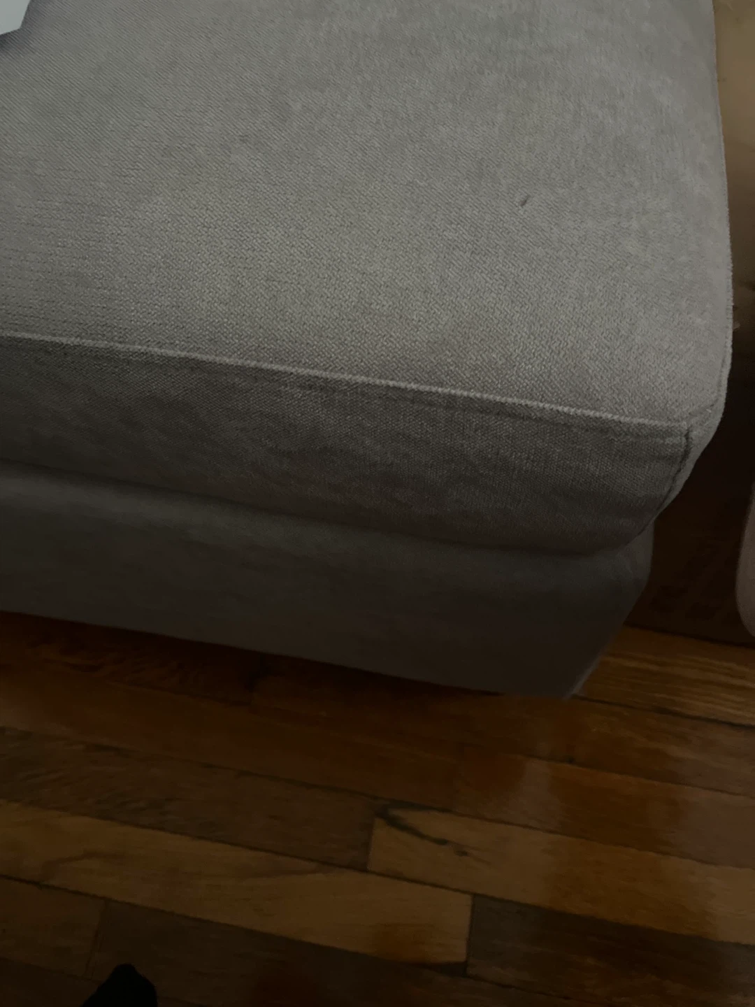 Gray upholstered furniture piece
