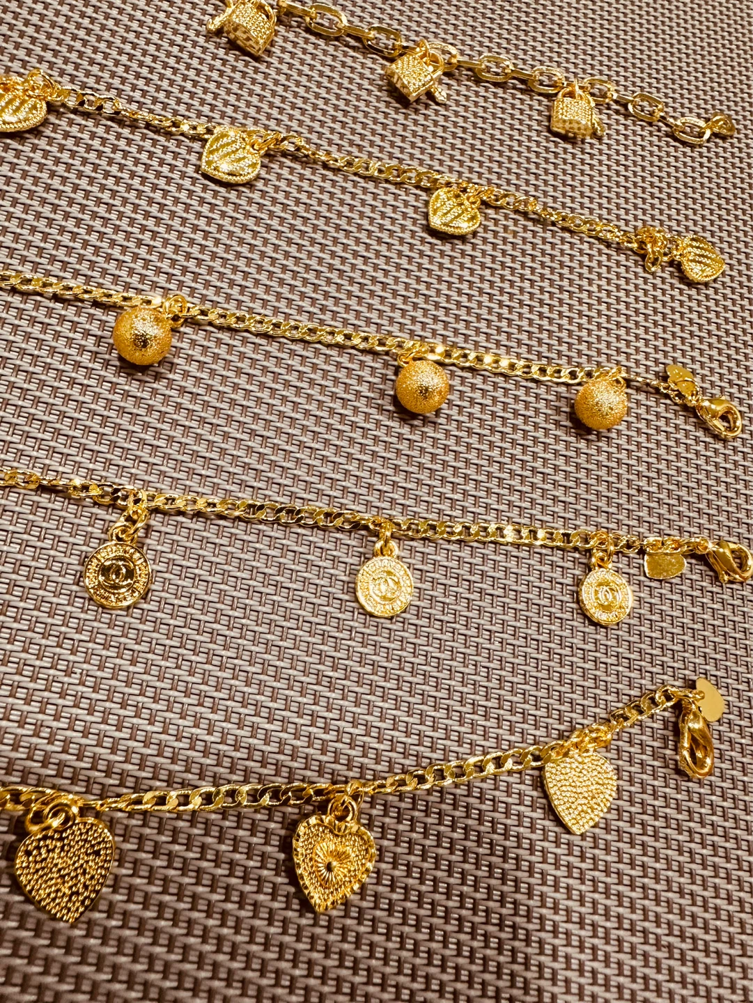 Set of 5 gold-tone charm bracelets